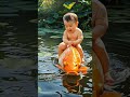 baby playing with whale