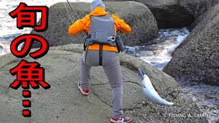 A woman fished from the rocks in the winter and caught a big, tasty fish.