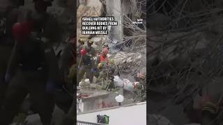 Israeli authorities recover bodies from building hit by Iranian missile