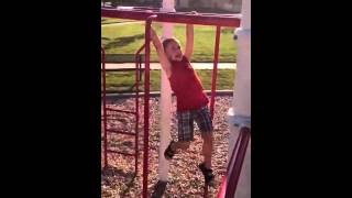 Hunter Gerrard playing on the Monkey Bars