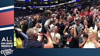 Bruce Pearl holds his granddaughter up for the Auburn faithful after Tigers defe