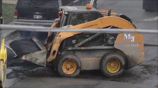 Case Skid Steer and Bomag Asphalt Roller At Work