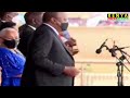 Uhuru and Ruto dancing together at Mashujaa Day celebrations