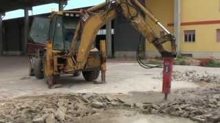 PROMOVE XP400 hydraulic hammer on CAT 428 breaking concrete floor