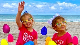 Egg Hunt Surprise Toys for Kids at the Beach with Elya and Adelya