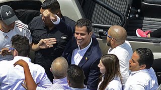 Opposition leader Juan Guaido returns to Venezuela despite arrest threats