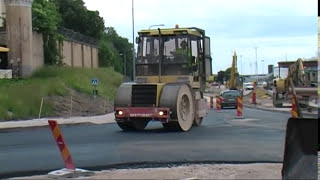 Scania och Volvo lastbilar transporterar asfalt till vägbygge i Visby hamn  2012.mpg