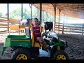 Using his gator to feed the cows and bulls! |kids on the farm