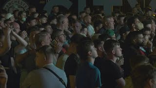 Disappointed Man City fans console each other after losing Champions League final | AFP