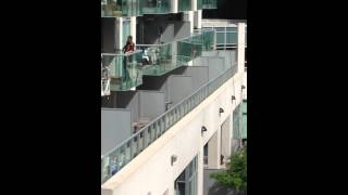 Guy falls off window cleaning platform