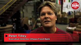 Sens coach, staff help sort food bank goodies