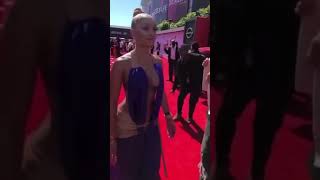 Saweetie and jack Harlow on BET red carpet.He stares at her with a smile.