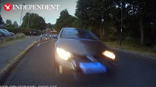 Moment driver in stolen car rams head-on into police motorcyclist