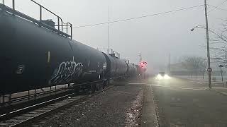 A GP38-2, 2 SD40-2 locomotives and a SD60I hauling an OC manifest train.