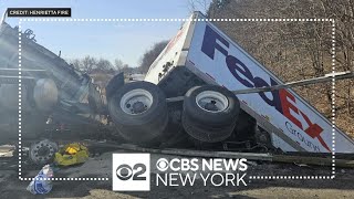 5 hospitalized after FedEx truck falls from highway overpass