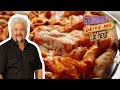 Guy Fieri Tries Baked Ziti PIZZA | Diners, Drive-Ins and Dives | Food Network