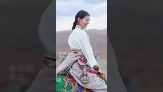 The Tibetan lady riding a horse called God.  Tibetan girl, Tibetan dress show, I am asking