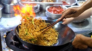 Chinese Street Food -Fried noodles with egg fried rice, fried broiler, egg and vegetable pie