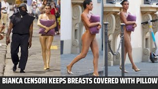 !! Kanye West !!  and Bianca Censori keeps   breasts covered with pillow  spotted  in italy