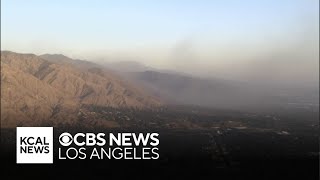 Ash from Eaton Fire burn scar flies near Altadena as winds whip region