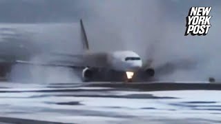 Dramatic video shows plane skidding across icy runway and onto muddy grass