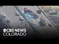 Semi rollover, crash closes lanes on I-70 near Ward Road northwest of Denver