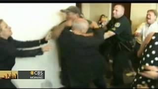 Families in murder case brawl outside courtroom