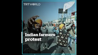 Indian farmers clash with police to protest against market reform
