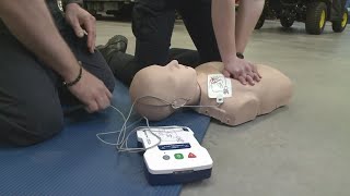 How to use an AED device to help someone in cardiac arrest