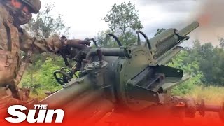 Russian soldiers fire explosive automatic mortars towards Ukrainian position