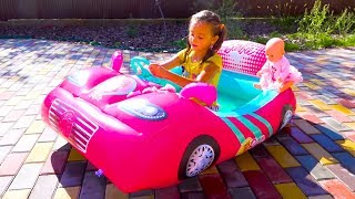 Fillip and Sasha play with inflatable swimming pools cars and Water Balloons