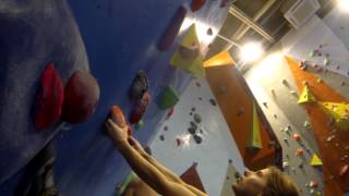 Hayley Climbing 7a+ on overhang bridge