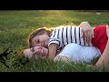 mother and daughter lying on grass. kiss