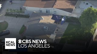 Man arrested after woman's body found inside trash can behind Costa Mesa home