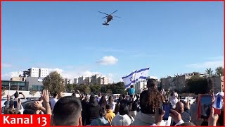 Crowd celebrates as helicopter brings four released hostages to hospital in Israel