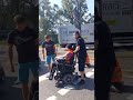 Furious motorists push climate protester in wheelchair off road