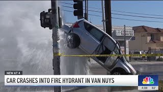 Water from broken fire hydrant sends car into air in Van Nuys
