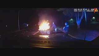 Intense dashcam video footage shows Colorado police's rescue after fiery crash