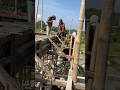 Filipinos pouring cement on bamboo scaffolding #filamcouple #philippines