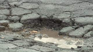 Why do potholes form?