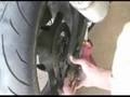 How to Replace the Sprocket & Chain on a Street Bike : Remove the Rear Brake on a Street Bike