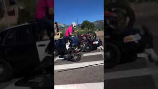 Cop Pulls Gun on Motorcycle for Wheelie