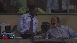 HOU@LAA: Broadcaster snags a foul ball from the booth