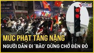 Mức xử phạt vượt đèn đỏ tăng nặng, người dân đi bão không quên chấp hành tín hiệu đèn giao thông