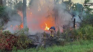 Multiple fire departments respond to grass fire in West Orange