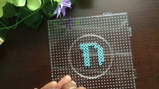 Capital letter “D” with fuse beads, alphabets with beads.