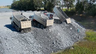 The incredible beauty of the project to pour rocks into the lake using Dump Trucks and wheel loader