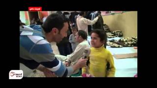 أورينت نيوز | مئات الاسر في حلب تستفيد من حملة توزيع الالبسة والاحذية بمناسبة العيد
