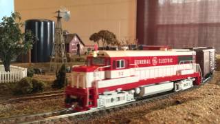 General Electric U25B Demonstrator #52 Pulling Freight Train