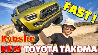 KYOSHO 2021 Toyota Tacoma TRD driving on the beach and jumping. It's pretty fast!